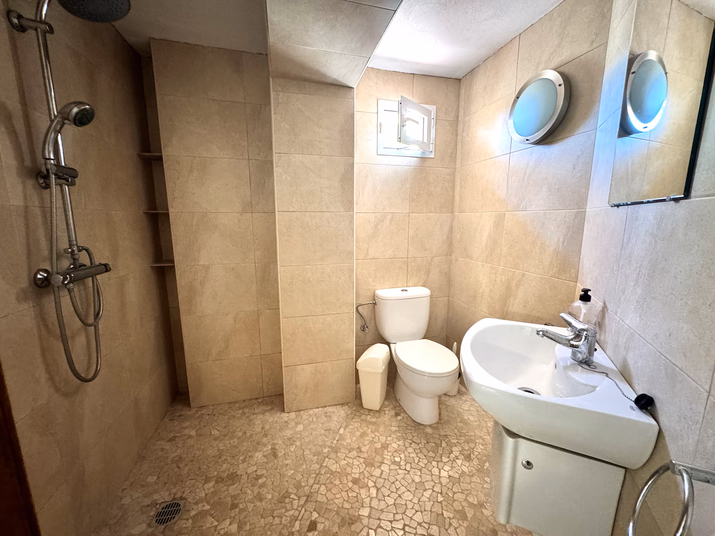 Tiled bathroom with walk-in shower