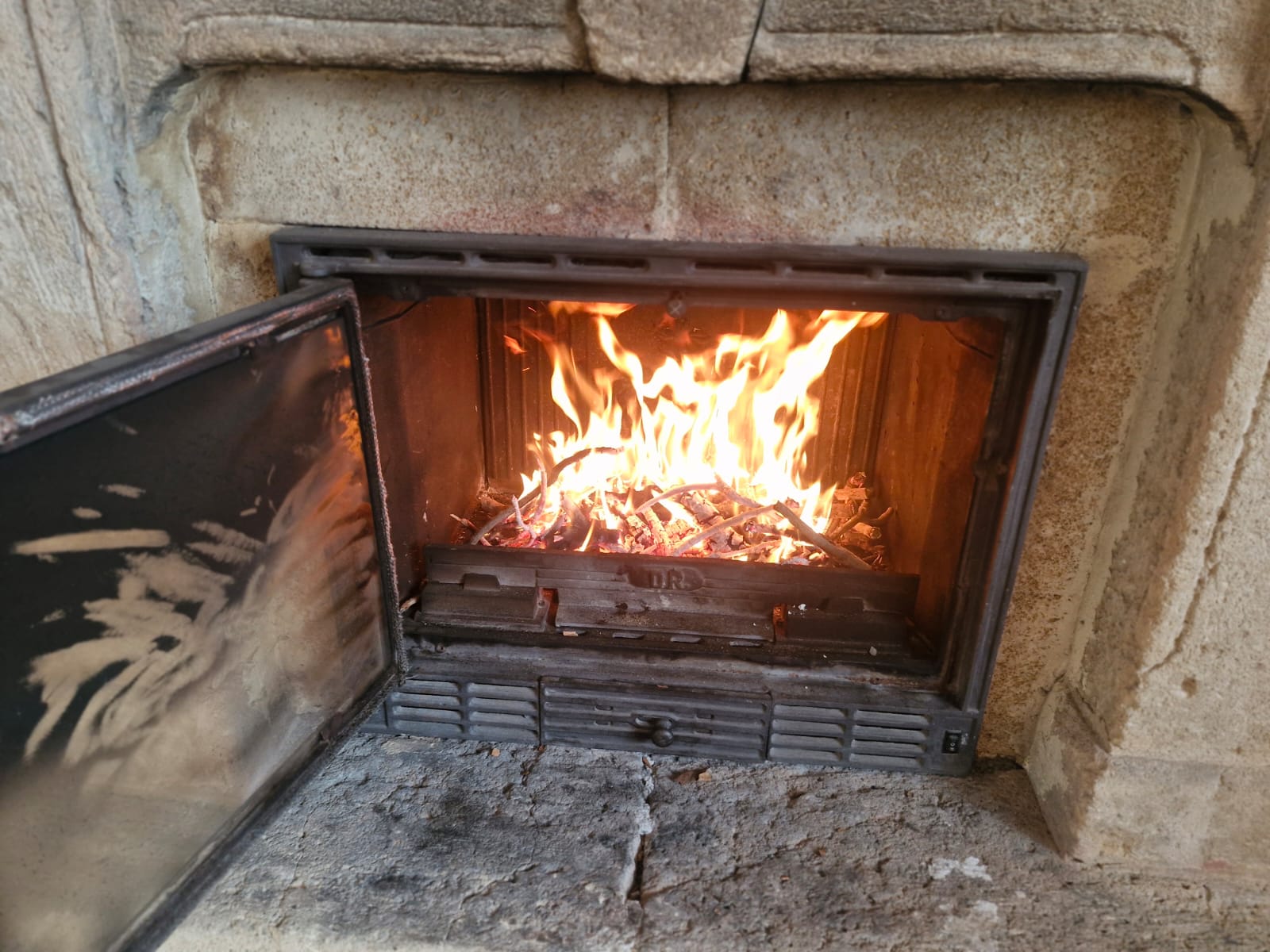 Lit fireplace with crackling fire