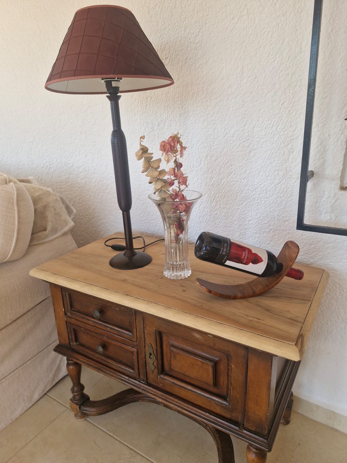 Rustic side table with lamp and wine holder